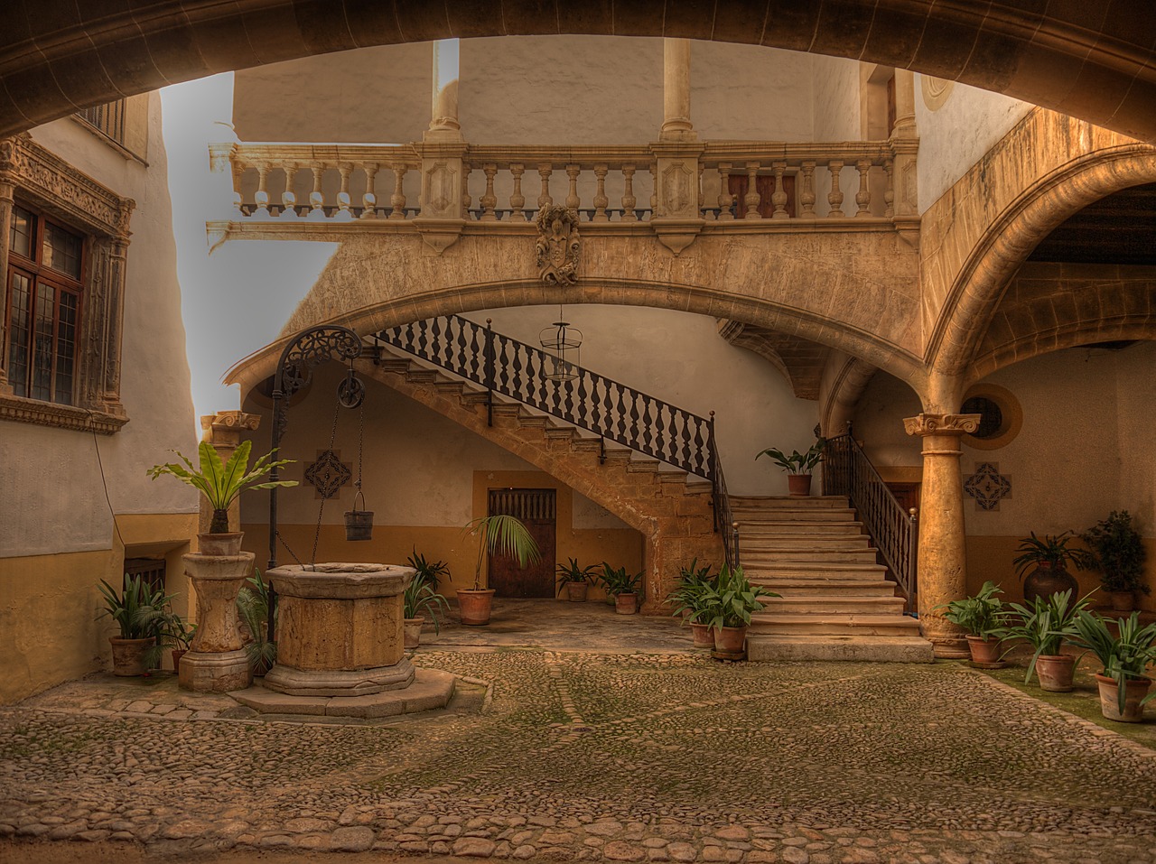 Beautiful ancient patio in Palma de Mallorca, a historic destination in Spain, showcasing traditional architecture and intricate design details